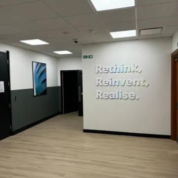 n office wall decorated with inspiring slogans.