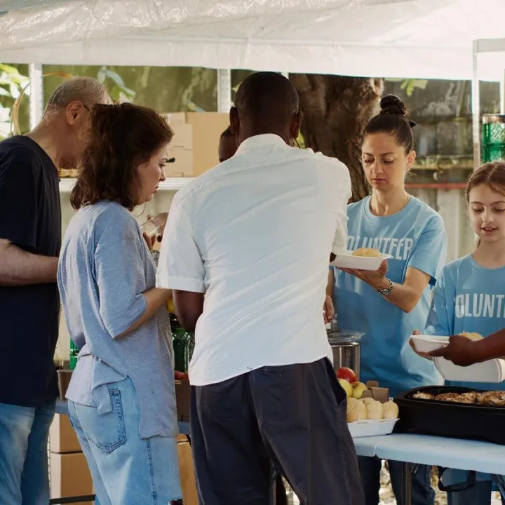 Outdoor food distribution event organized by a non-profit, d