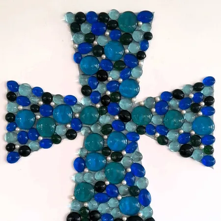 Framed glass cross made by the Friendly Faces group (2025)