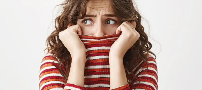 Scared timid woman looking left, shivering and