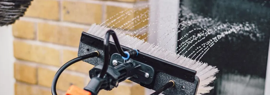 Close-up of water sprinkling on window