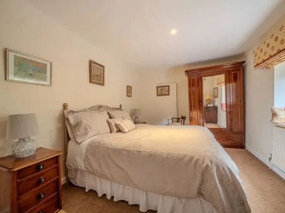 Bedroom three with a king-size bed and en-suite shower room