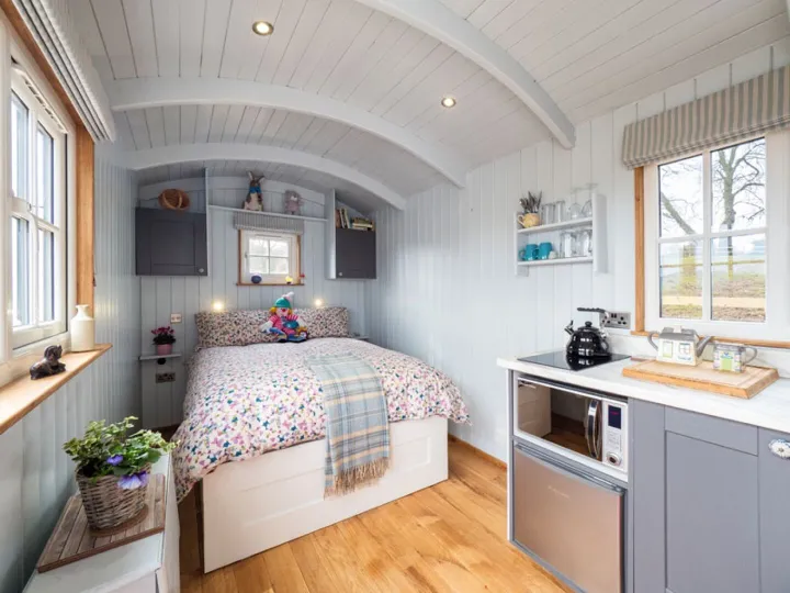 Inside the Shepherd’s Crook with its double bed and kitchen