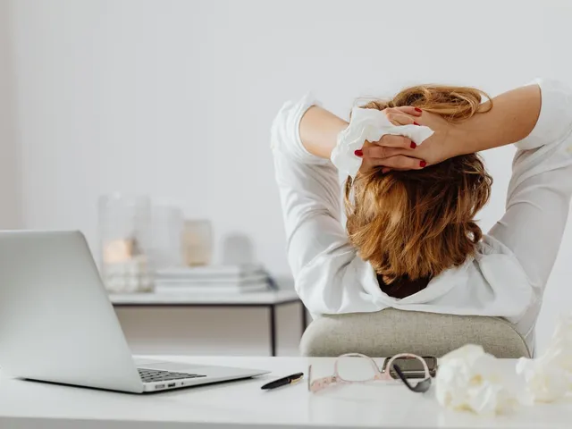 Office worker stretching at a desk