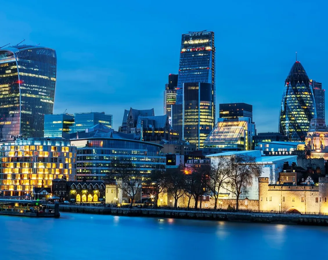 The London skyline at dusk, seen across the River Thames