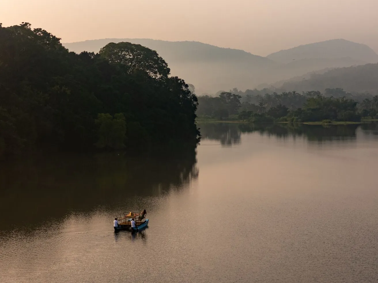 Still water and distant hills on Wewela Lake below Peacock Hill Sigiriya
