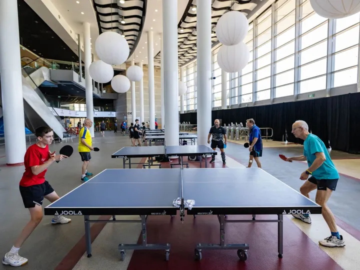 Exciting table tennis game in a modern indoor