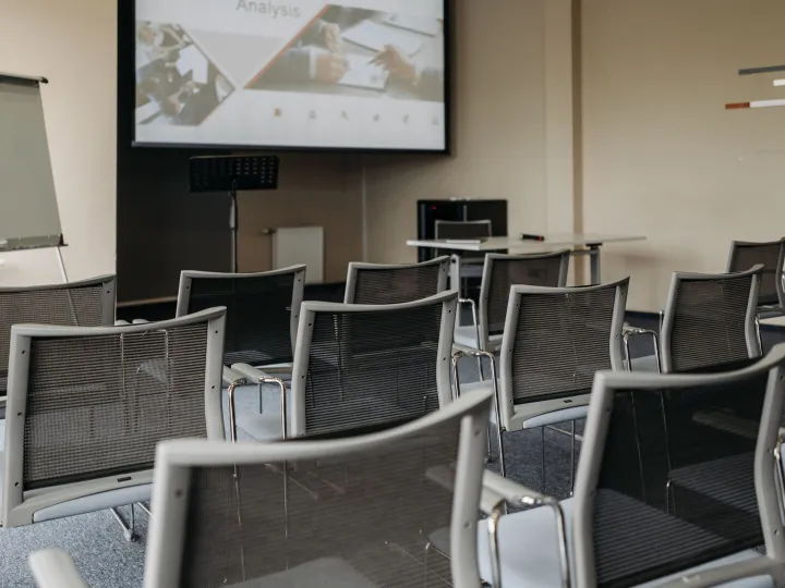 Modern conference room setup with empty chairs