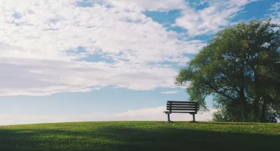 Empty bench on a hill