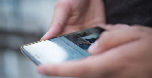Person Using Smartphone Shallow Focus Photography