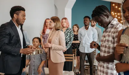 Group of People Standing and Smiling