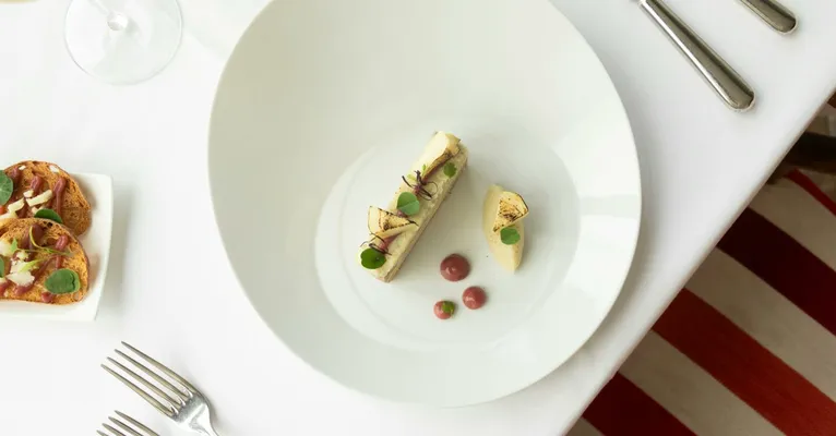 Top view of gourmet French cuisine in a fine dining setup, Vonnas, France.