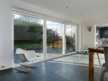 uPVC patio door with a white chair