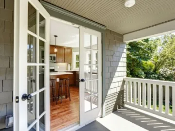 French doors open onto a patio