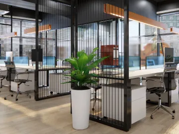 Office workstations with a large green plant