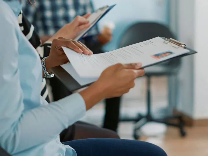 Female candidate sitting in queue and receiving cv files, wa