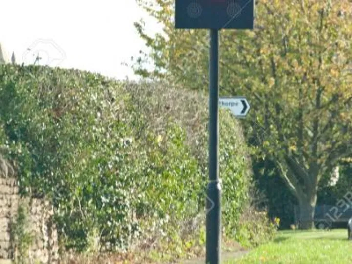 30mph-flashing-speed-limit-sign-on-a-typical-british-road