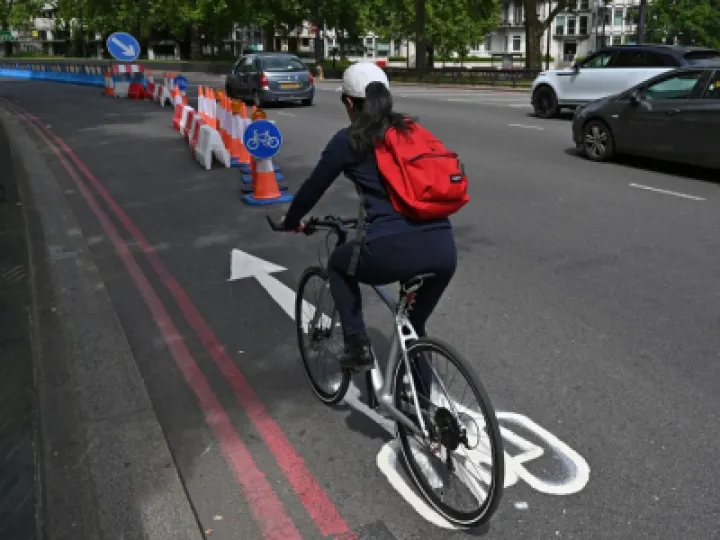 Woman Cycling on Cycle Route