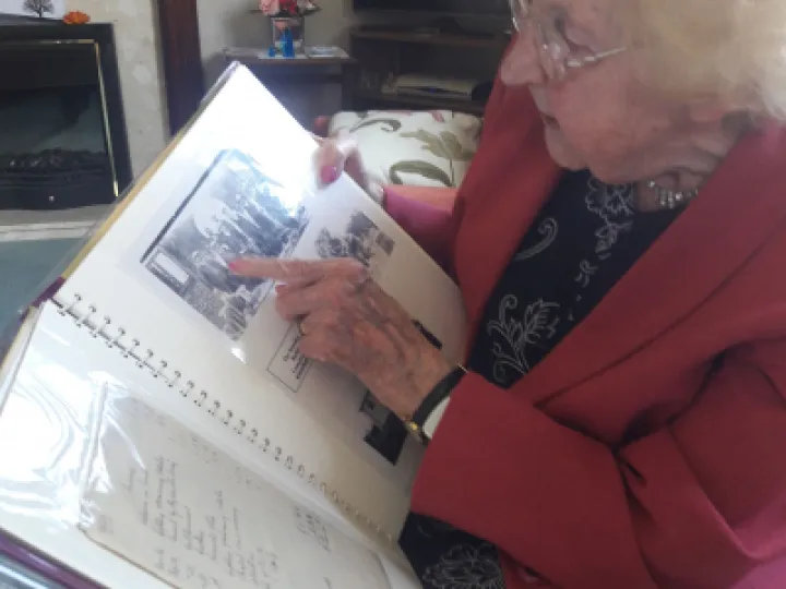 1 LEAFING THROUGH AN ALBUM DORISS PARENTS LEFT HER  DEPICTING THE CHAPELS SEMINAL MOMENTS