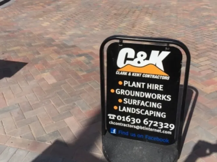 Clark & Kent patio laying advert panel