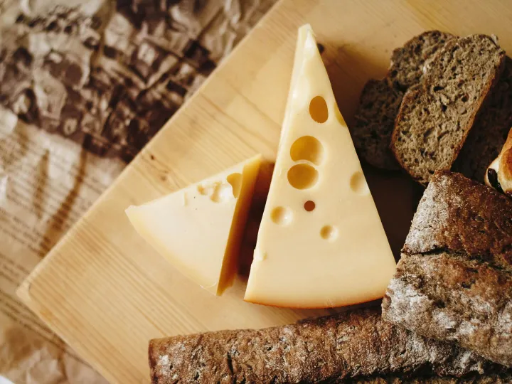 Close-up of cheese and rustic bread on a wooden