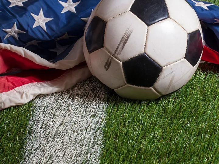 Soccer ball on an American flag symbolising Bank of America’s new sports partnership and the growing U.S. football market