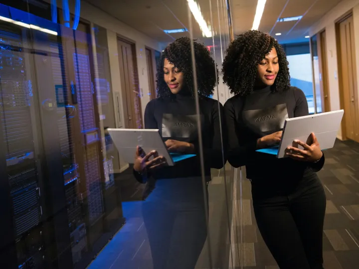 African American woman standing in modern office u