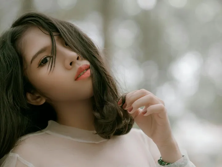 Stylish close-up of a young woman with flowing hai